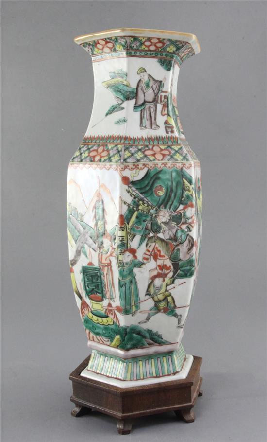 A Chinese famille verte hexagonal baluster vase, late 19th century, height 35cm, wood stand
